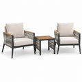 Conjunto de jardín con sillones de metal y madera, cojines beige